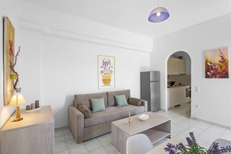 Levander apartment, Flora Apartments Paros – living room with sofa and dining area